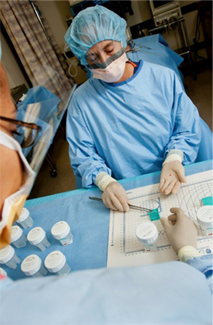 A technician dissects and preserves a tissue sample using the GTEx PAXgene tissue preservation system. (Image from the National Disease Research Interchange GTEx Team)