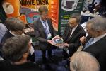 Steven Chu, Secretary of the United States Department of Energy, holds a model of the wave disk engine at the 2011 ARPA-E Summit's Technology Showcase. | Photo by Ken Shipp.