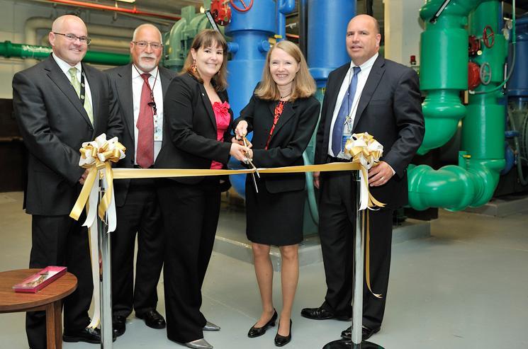 Officials from the Energy Department and NORESCO cut the ribbon at the new chiller plant in the Forrestal building. The chiller is expected to save $600,000 per year from the Department's energy bills.