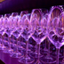 Photo of rows of wineglasses.