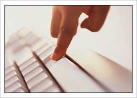 Finger typing on keyboard.