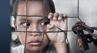 Series of images depicting human trafficking victimization: a child trapped behind a locked fence; a young girl in chains in prison; and street hustling scene.