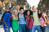 A group of teens pose together.