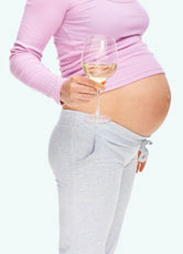 A pregnant woman drinks alcohol.