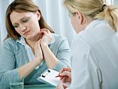 A woman meets with her doctor.