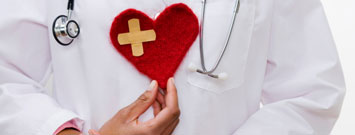 Photo: Physician holding felt heart