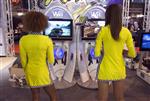 Hostesses play Wii games during the video game show in Paris September 17, 2009. REUTERS/Charles Platiau