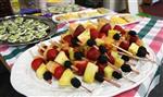 The food at the Lookout Mountain Preschool including fruit kabobs are readied for a healthy school party for Mother's Day in Golden, Colorado May 10, 2012. REUTERS/Rick Wilking