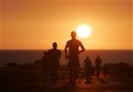 Athletes are seen running during a triathlon in Kailua-Kona, Hawaii, October 10, 2009. REUTERS/Hugh Gentry