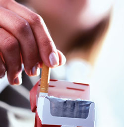 Cigarette being pulled from pack