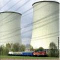 Date: 04/10/2001 Location: Biblis, Germany Description: A train with spent nuclear fuel in a special container in the last car slowly passes the huge cooling towers as it leaves the nuclear power plant in Biblis, Germany, Tuesday, April 10, 2001, headed for the nuclear reprocessing plant in La Hague, western France.© AP Image