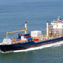 Cargo ship traveling in open water.