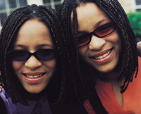 Twin women smiling.