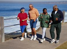 Photograph of two women and two men walking