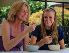 Mother and daughter eating ceral together