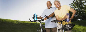 Photo: A man and woman riding bicycles.