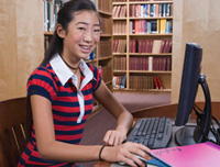 Photo of a girl using her computer