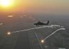Apache flies over Iraq at sunrise