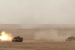 In a Combined-Arms Live-Fire Exercise at the Udari Range May 8, 2012, units of the...