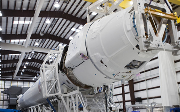 Technicians move a SpaceX Dragon capsule into place at the nose of the company's Falcon 9 rocket during preparations to launch the spacecraft on a cargo flight to the International Space Station. Credit: NASA