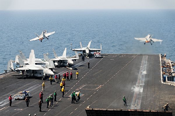 An F/A-18C Hornet assigned to the Rampagers of Strike Fighter Squadron (VFA) 83, left, and an F/A-18C Hornet assigned to the Wildcats of Strike Fighter Squadron (VFA) 131 launch from the aircraft carrier USS Dwight D. Eisenhower (CVN 69). Dwight D. Eisenhower is deployed to the U.S. 5th Fleet area of responsibility conducting maritime security operations, theater security cooperation efforts and support missions for Operation Enduring Freedom. The U.S. Navy is constantly deployed to preserve peace, protect commerce, and deter aggression through forward presence. Join the conversation on social media using #warfighting.  U.S. Navy photo by Mass Communication Specialist Seaman Sabrina Fine (Released)  121002-N-NB538-005