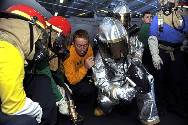 Aviation Boatswain's Mate (Handling) 1st Class Billy Vandaveer instructs Sailors on using the naval firefighting thermal imager (NFTI) during hangar bay firefighting drills aboard the aircraft carrier USS Harry S. Truman (CVN 75). Harry S. Truman is underway conducting tailored ship's training availability. The U.S. Navy is reliable, flexible, and ready to respond worldwide on, above, and below the sea. Join the conversation on social media using #warfighting.  U.S. Navy photo by Mass Communication Specialist Seaman Lorenzo J. Burleson (Released)  121004-N-PL185-056