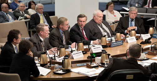 NRC staff briefs the Commission on plans for overseeing nuclear materials users, decommissioning and low-level waste for the next fiscal year. NRC staff pictured at the table (left to right):  Region IV Regional Administrator Elmo Collins; Director, Division of Materials Safety and State Agreements Brian McDermott; Director, Office of Federal and State Materials and Environmental Management Programs Mark Satorius; Executive Director for Operations Bill Borchardt, Director, Office of Nuclear Security and Incident Response Jim Wiggins and Director, Office of Nuclear Regulatory Research Brian Sheron. 