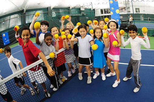 Kids playing with tennis balls