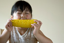 Child Eating Corn