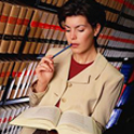 pensive woman reading in a library