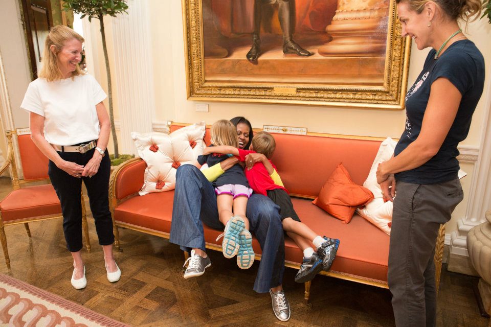 First Lady Michelle Obama greets former Olympic swimmer Summer Sanders and her children, Skye and Robert, following a Let's Move! London event at Winfield House in London, England, July 27, 2012. Sanders is serving as part of the U.S. delegation to the 2012 Olympic Games in London. (Official White House Photo by Sonya N. Hebert)