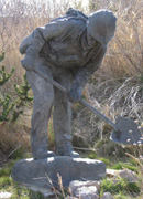 photo of statue with shovel