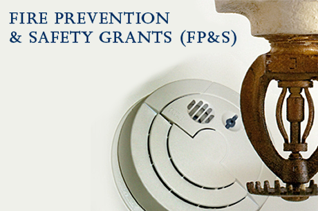 Fire Prevention & Safety Grants banner with a picture of a fire alarm and light fixture.