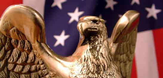 Image of the American flag and a statue of an Eagle
