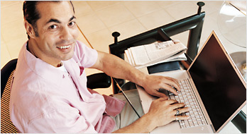 Photo of a person using a laptop