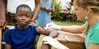 Young boy receiving a vaccine.