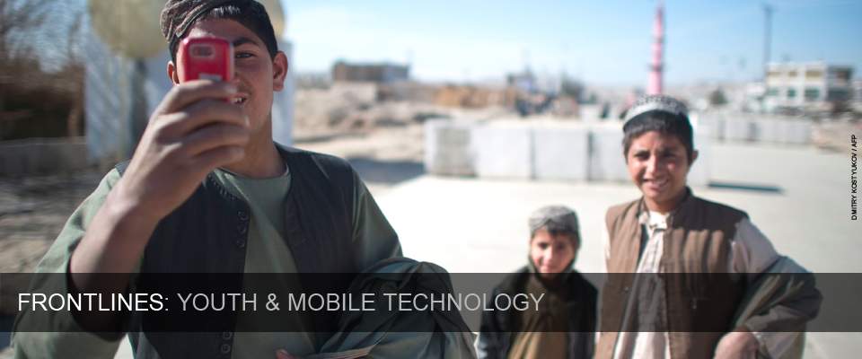 Frontlines: Youth and Mobile Technology. Credit: AFP