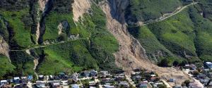 Aerial view of a land slide down a mountain with earth covering