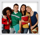 Teenage friends with books and smiling