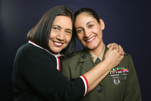 Smiling United States Marine posing with her mother