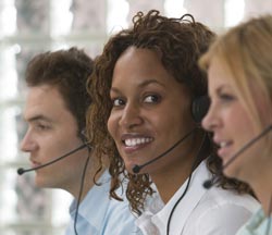 three people working in a call center