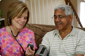 Nurse Taking Blood Pressure of Older Man