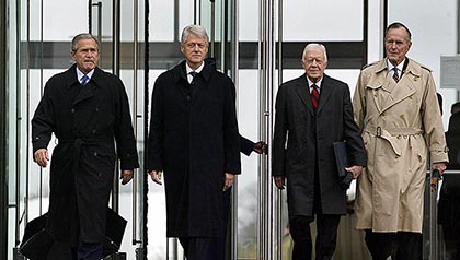 US President George W. Bush, and former US Presidents Bill Clinton, Jimmy Carter, and George Bush, are announced at the grand opening ceremony of the Clinton Presidential Center