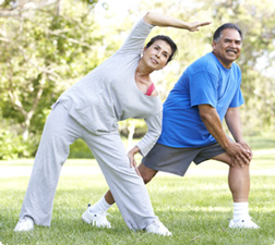 Older couple warming up for exercise