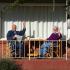 Two people sitting on a porch: Copyright iStock Photos
