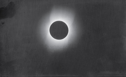 Image description: This photograph of the corona of the sun was taken during a solar eclipse in 1900 by Smithsonian photographer Thomas Smillie. A team from the Smithsonian Astrophysical Observatory loaded several railroad cars with scientific equipment and headed to Wadesboro, North Carolina. Scientists had determined that this small town would be the best location in North America for viewing an expected total solar eclipse, and the expedition hoped to capture photographic proof of the sun&#8217;s corona. Smillie rigged cameras to seven telescopes and successfully made eight glass-plate negatives. At the time, Smillie&#8217;s work was considered an amazing photographic and scientific achievement.
Image courtesy of the Smithsonian Institution Archives