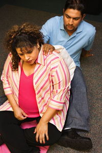 man and a woman in a birthing class