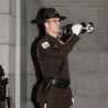A U.S. Fish and Wildlife Service Guard Member plays a trumpet at the Law Enforcement Office Memorial Ceremony