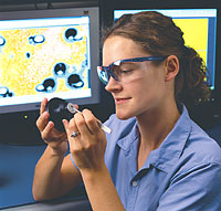 woman researcher works on magnetic trap