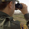 Border security agent with binoculars